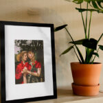 Vertical Photo Frame on a Shelf in the Half-Side View Mockup
