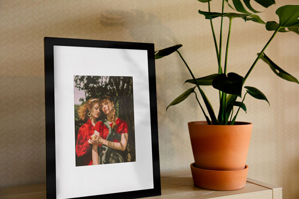 Vertical Photo Frame on a Shelf in the Half-Side View Mockup