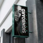Vertical Shop Signboard Mockup with Metallic Frame on Building