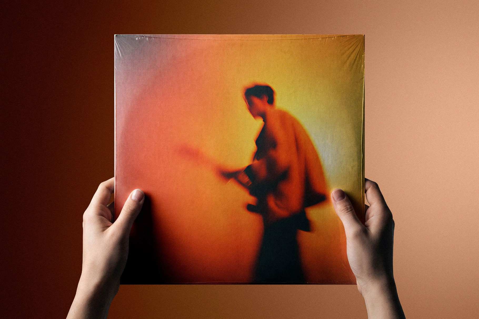 Free Vinyl Cover Mockup in Hand PSD Template