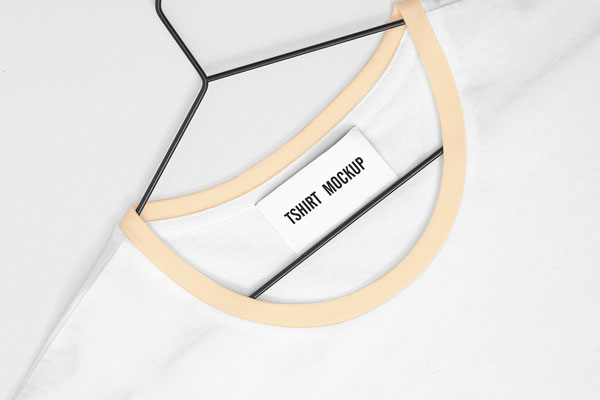 White T-Shirt Mockup with a Chest Logo and a Neck Tag