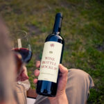 Wine Bottle in Hand Mockup