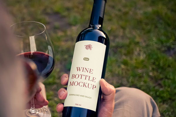 Wine Bottle in Hand Mockup