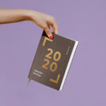 Woman Holding a Notebook / Calendar Mockup