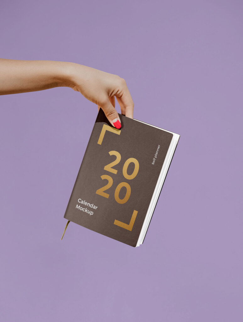 Woman Holding a Notebook / Calendar Mockup