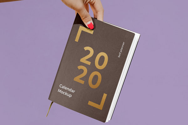 Woman Holding a Notebook / Calendar Mockup