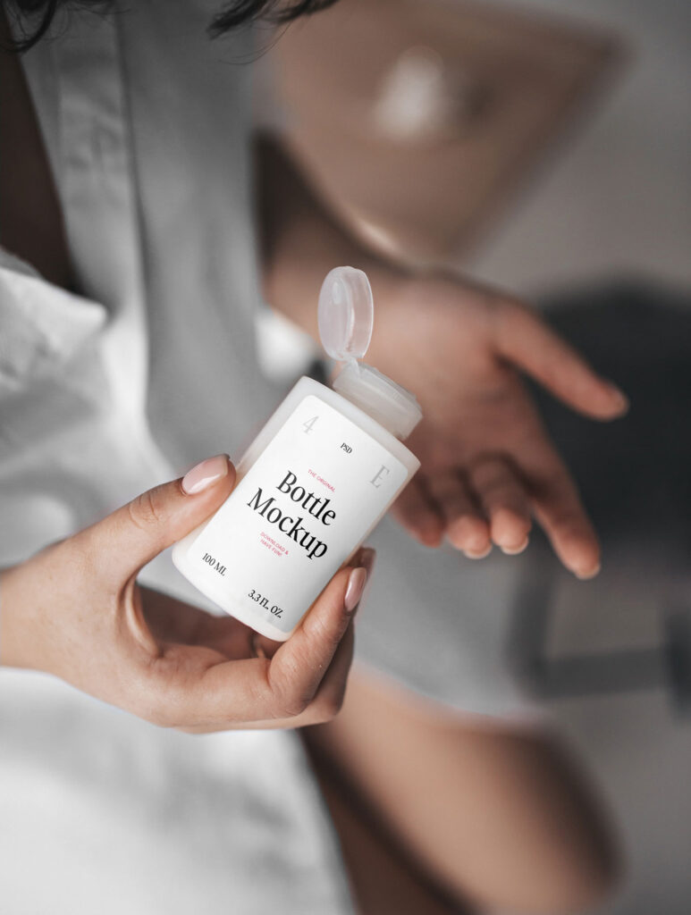 Woman Holding Realistic Mini Bottle Mockup from Top View