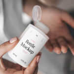 Woman Holding Realistic Mini Bottle Mockup from Top View