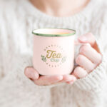 Woman Holding Tea Mug in Hand Mockup