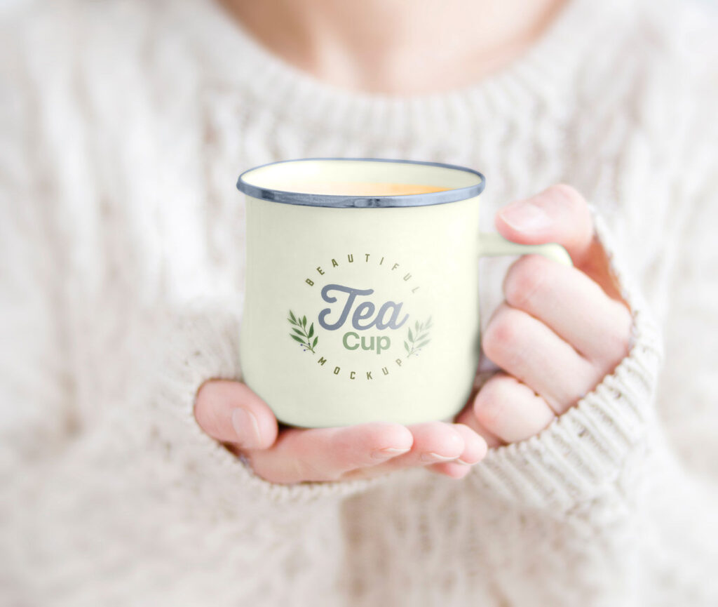 Woman Holding Tea Mug in Hand Mockup