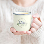 Woman Holding Tea Mug in Hand Mockup