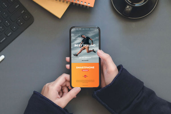 Workstation Mockup of Smartphone in a Person’s Hand